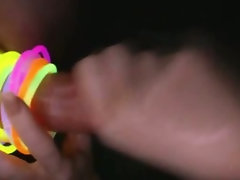 Kinky hoe caresses prick in the dark and puts glowing rings on it