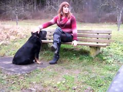 Transsexual sitting on Parkbench near road