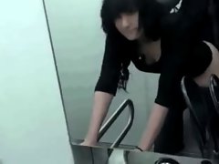 Raven-Haired Lassie Strokes & Screws In The WC