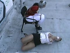 two wenches bound tightly on roof