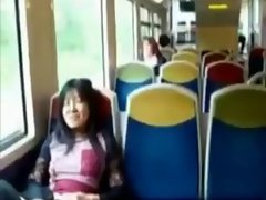 Asian mommy rubs her clit on a train.