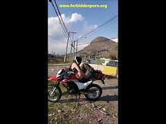 Biker female masturbating in the middle of the road